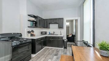 House, Multiple Beds, Balcony, Garden View (Chic Modern Gem w/ Style Suites) | Private kitchen | Fridge, microwave, oven, stovetop