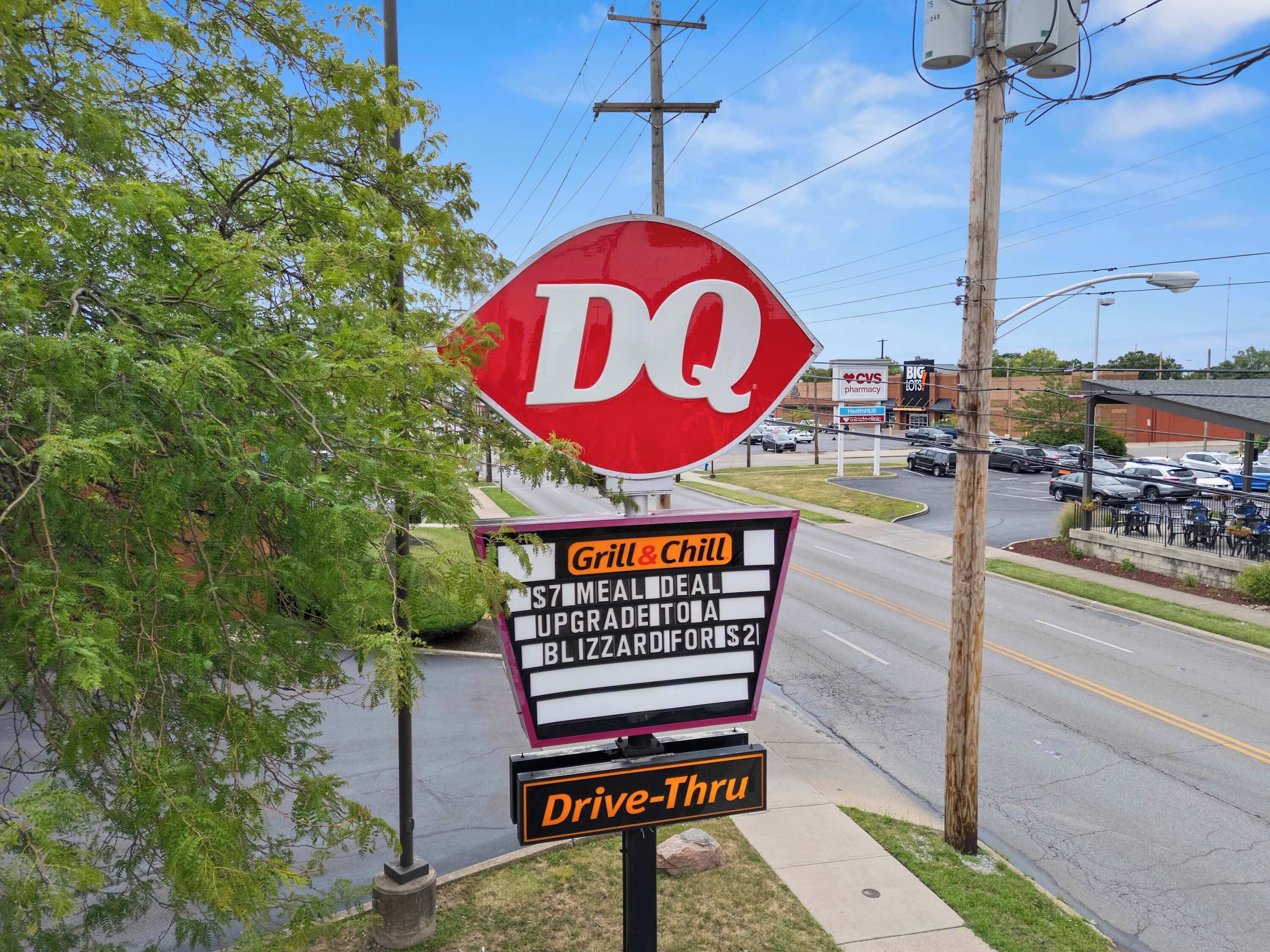 A DQ sign with a drive-thru and a sign for Grill & Chill.