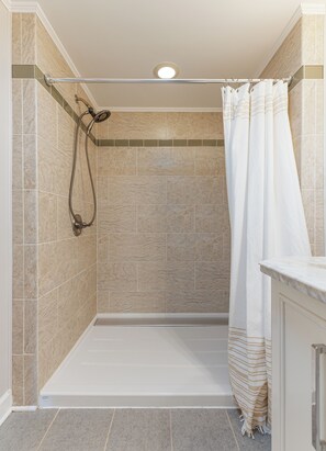 Shower, hair dryer, towels, soap