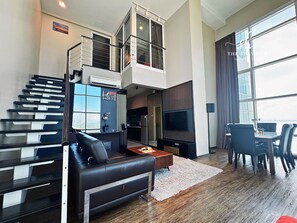 Deluxe Loft, 2 Bedrooms, Non Smoking, Sea View | Living area | 30-inch LED TV with digital channels - Seaview Maritime Suites by The Stay Hub (George Town)