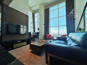 Deluxe Loft, 2 Bedrooms, Non Smoking, Sea View | Living area | 30-inch LED TV with digital channels - Seaview Maritime Suites by The Stay Hub (George Town)