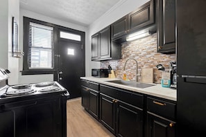 Apartment, Multiple Beds, Patio, Garden View (Merion Village Residences 1166) | Private kitchen | Fridge, microwave, oven, stovetop