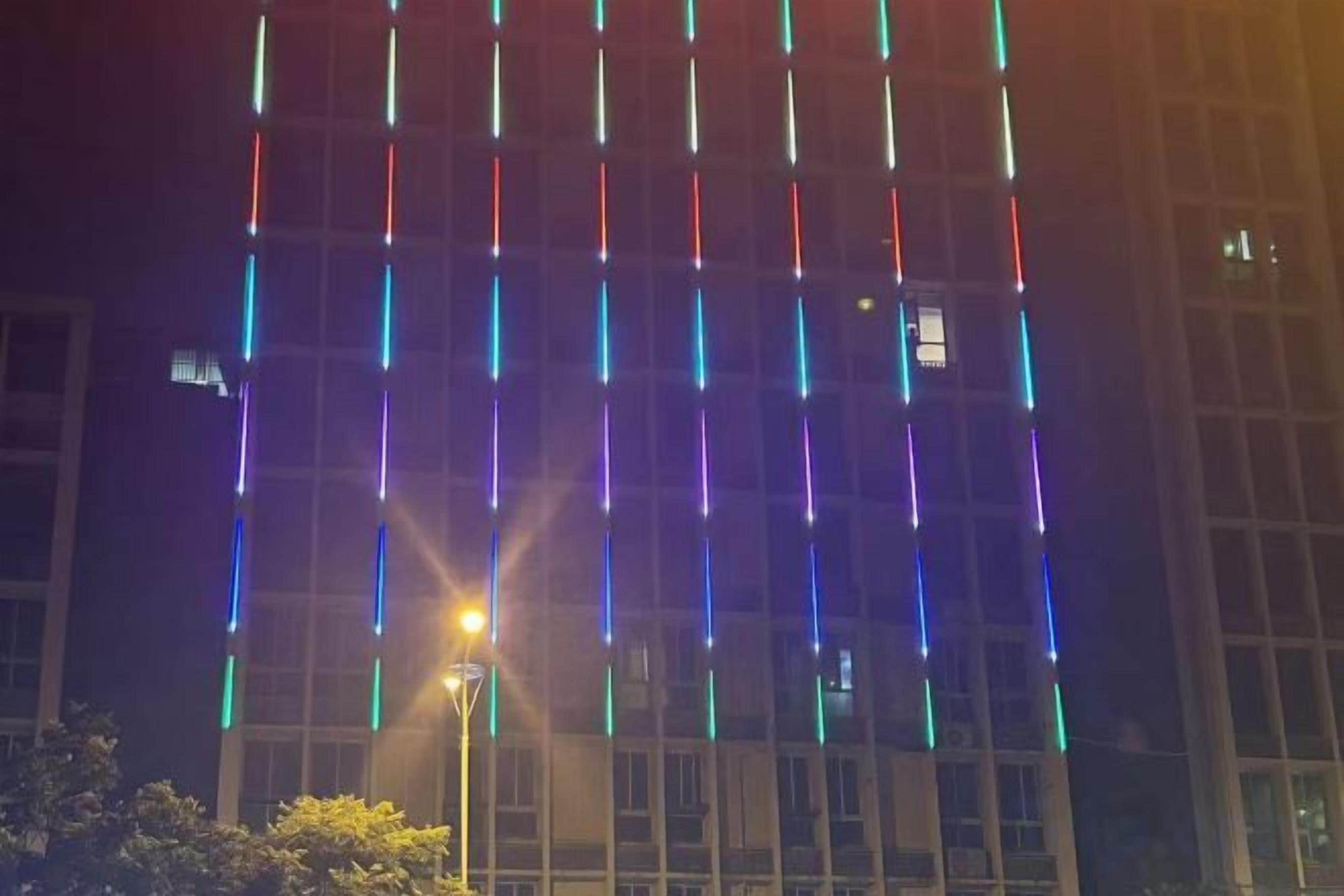A building facade with vertical light strips.