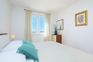 Apartamento (1 Bedroom) | 1 quarto, ferros/tábuas de passar roupa, roupa de cama