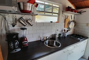 Fridge, microwave, stovetop, coffee/tea maker