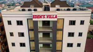A multi-story building with a sign reading 'EDEN'S VILLA'. - Edens Villa Kumasi (Kumasi)