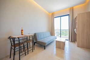 Suite Sea View | Living area | 42-inch Smart TV with digital channels