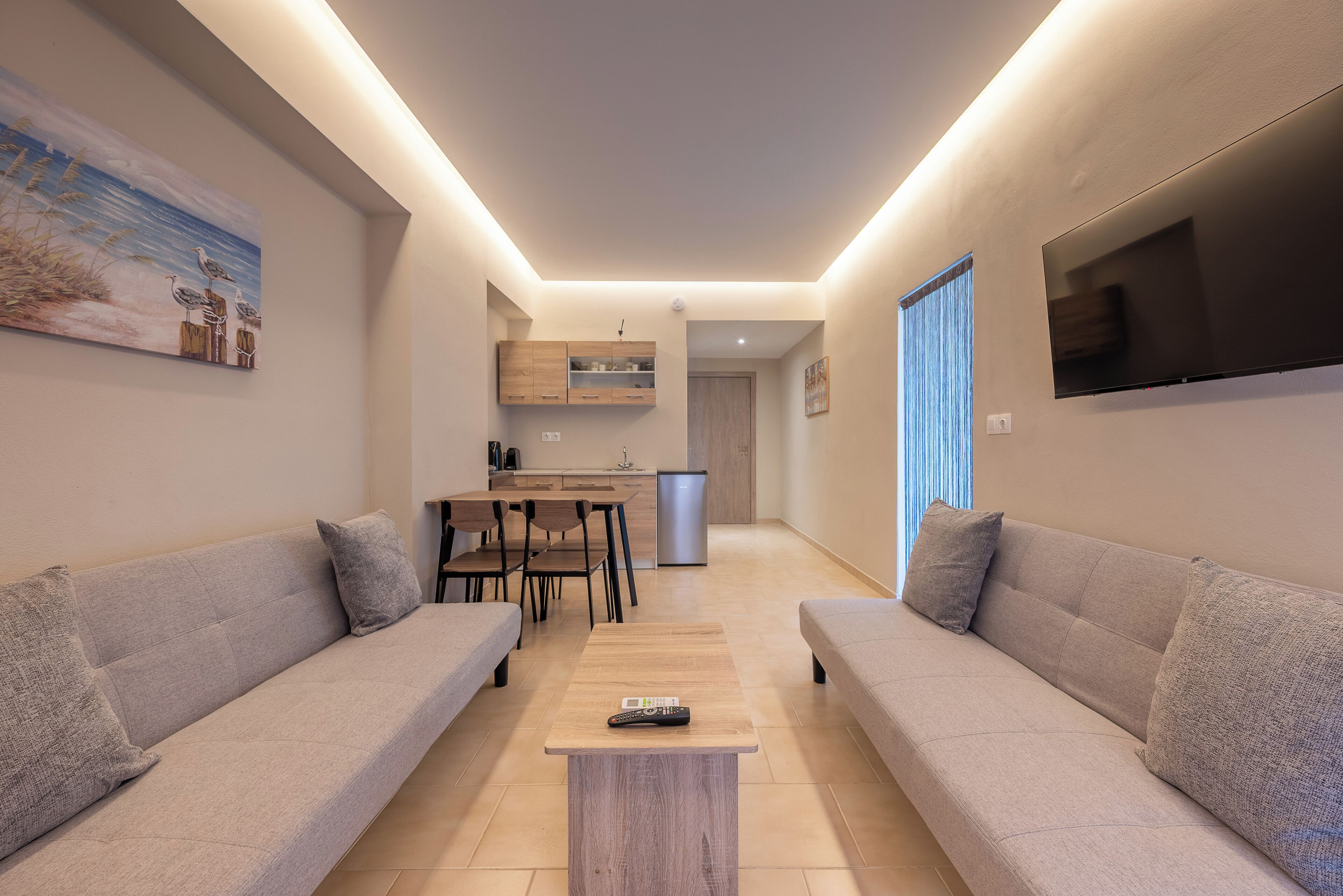 Suite City View | Living area | 42-inch Smart TV with digital channels