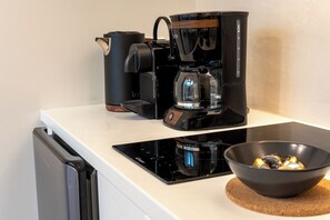 Fridge, microwave, stovetop, coffee/tea maker