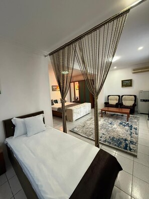 Family Quadruple Room, Kitchen, Partial Sea View | Living area | TV - Old City Hatefi Apartments (Baku)