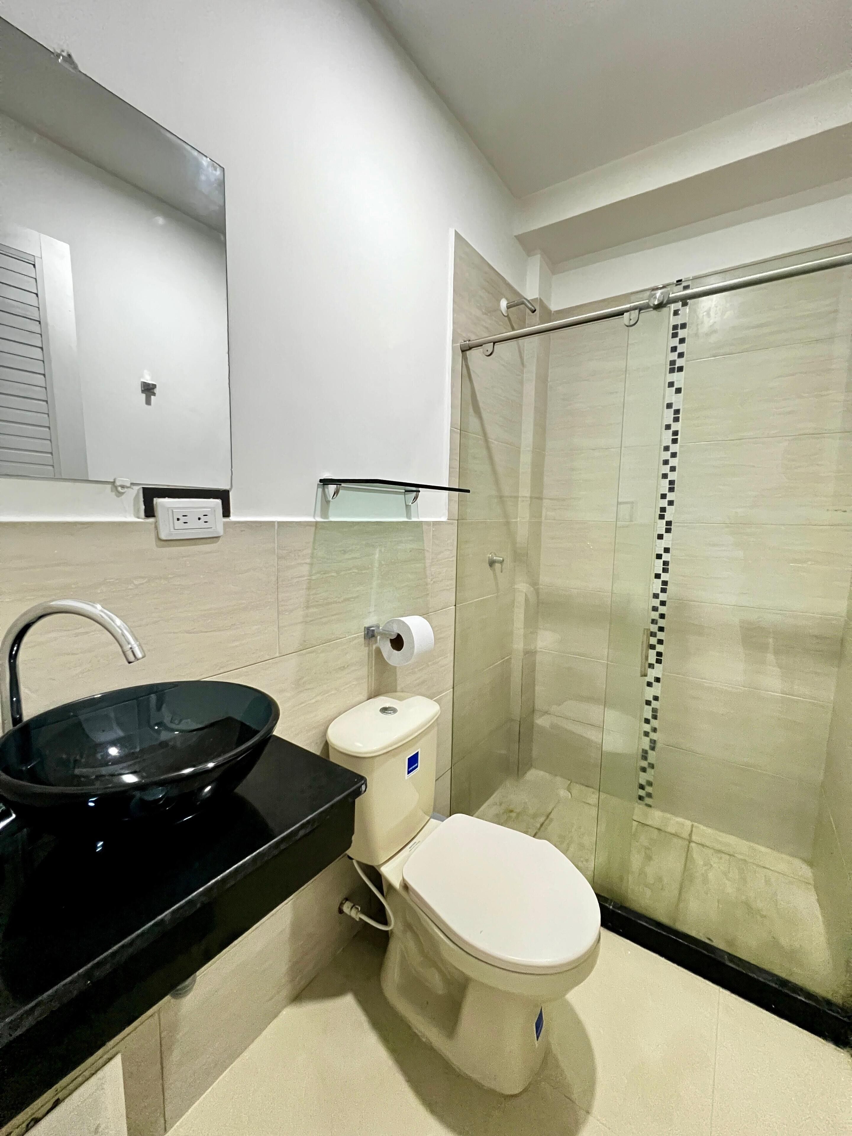 Shower, towels, soap, toilet paper