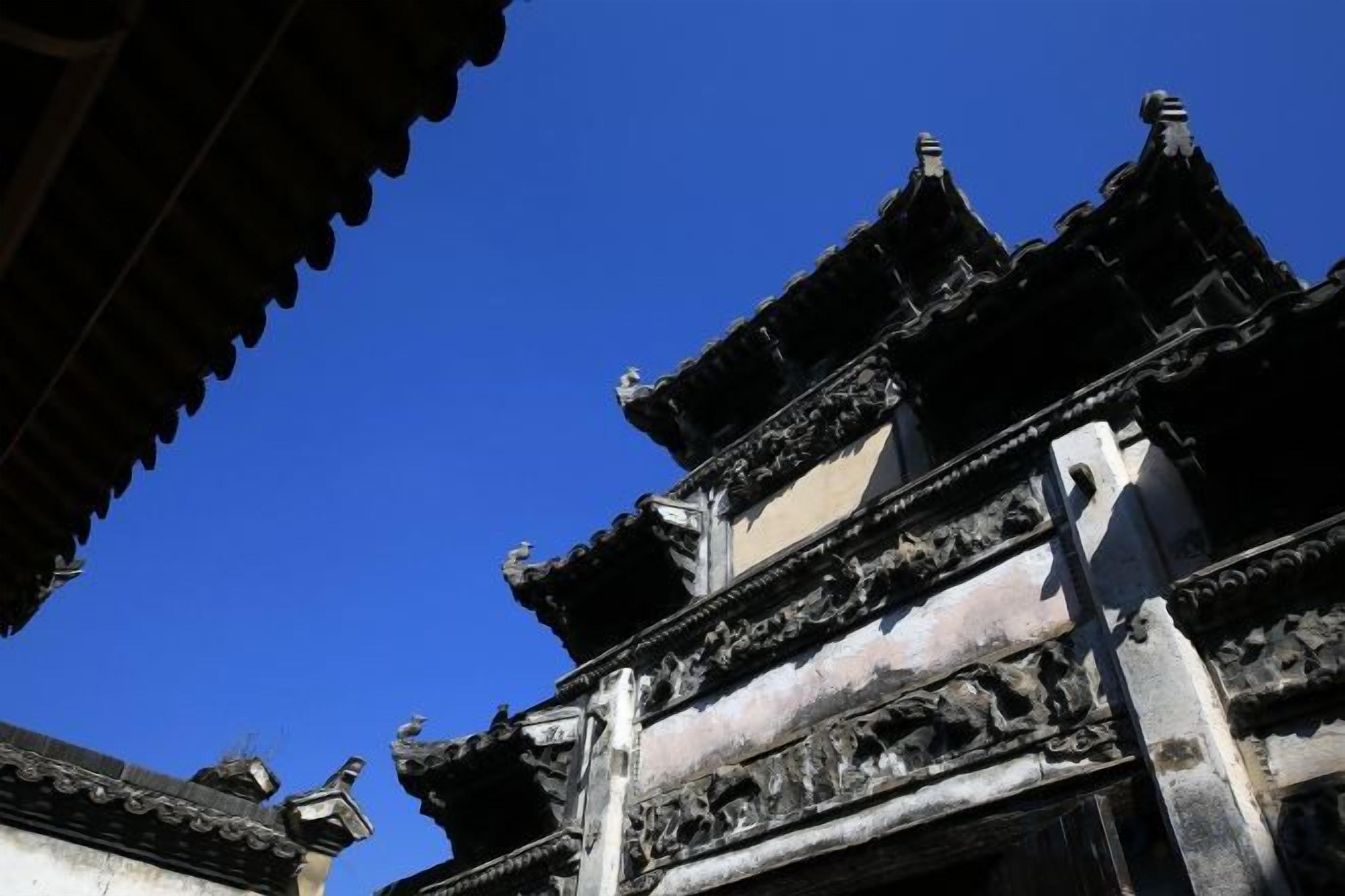 A traditional building with tiered roofs and ornate architectural details.