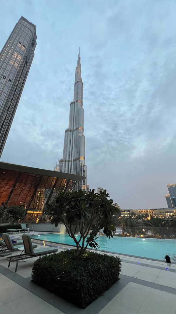 Outdoor pool, open 7:00 AM to 10:00 PM, pool umbrellas, pool loungers