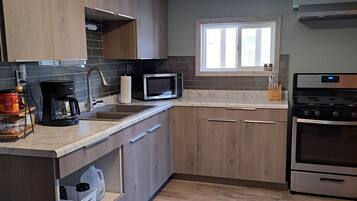 Fridge, microwave, stovetop, coffee/tea maker