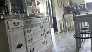 A kitchen with a coffee bar, a chalkboard menu, and a vintage dresser. - 4-bedroom house in fantastic Mountain View with AC, WiFi!!!! (Mountain View)