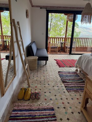 Habitación Deluxe con 1 cama matrimonial o 2 individuales | Área de sala de estar