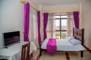 Deluxe Double Room | In-room safe, desk, laptop workspace, iron/ironing board - TreasureView Courts (Kampala)
