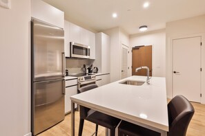 Deluxe Apartment, Kitchen | Private kitchen