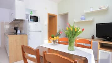 Apartment (Classic Two Bedroom Apartment with Ba) | Living room | 32-inch flat-screen TV with satellite channels
