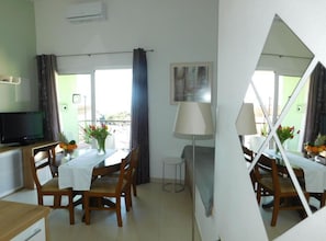 Apartment (Classic Two Bedroom Apartment with Ba) | Living room | 32-inch flat-screen TV with satellite channels