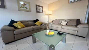 Apartment (One Bedroom Apartment) | Living room | 32-inch flat-screen TV with cable channels