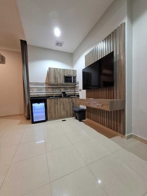 Mini-fridge, microwave, electric kettle, dining tables