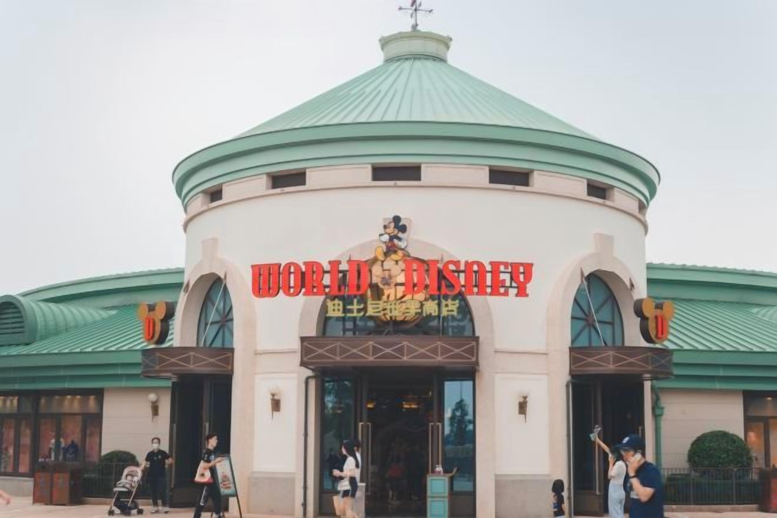 A building with a dome roof and the sign 'WORLD DISNEY' indicating a themed attraction.
