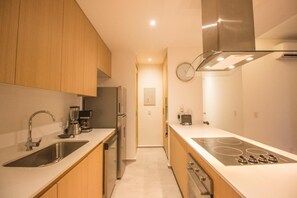 Deluxe Apartment, 2 Bedrooms, Balcony, Resort View | Private kitchen | Microwave, coffee/tea maker