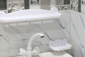 Shower, bidet, towels, soap