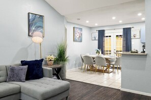 Smart TV, fireplace, books, computer monitors