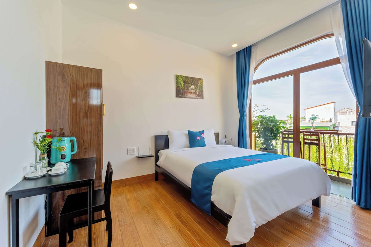 Deluxe Double Room, Balcony, City View | In-room safe, desk, laptop workspace, iron/ironing board