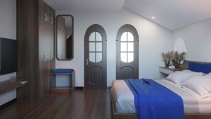 A modern bedroom with a large bed, a wooden wardrobe, a small bench, and a TV. - The View Boutique Hoi An (Da Nang)