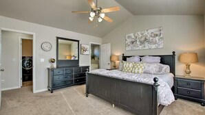 A bedroom with a bed, dresser, nightstands, ceiling fan, and artwork on the walls. - Wyngate Retreat Mtn view home, BBQ, 4 bed, 17 Mi from Snowbird. (South Jordan)