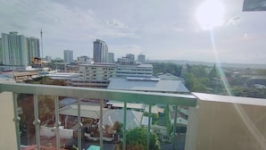 A cityscape with high-rise buildings, a water tower, and a mix of residential and commercial structures.