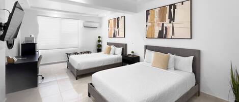 Desk, travel crib, free WiFi, bed sheets