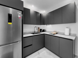 Fridge, microwave, stovetop, coffee/tea maker