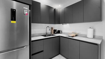 Fridge, microwave, stovetop, coffee/tea maker