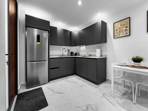 Fridge, microwave, stovetop, coffee/tea maker