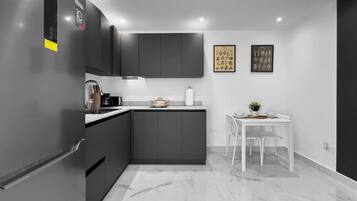 Fridge, microwave, stovetop, coffee/tea maker