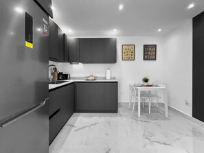 Fridge, microwave, stovetop, coffee/tea maker