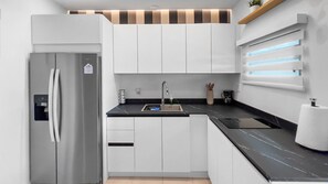 Fridge, microwave, stovetop, coffee/tea maker