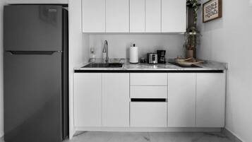 Fridge, microwave, stovetop, coffee/tea maker