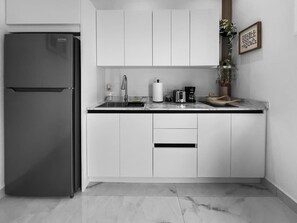 Fridge, microwave, stovetop, coffee/tea maker