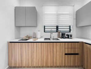 Fridge, microwave, stovetop, coffee/tea maker