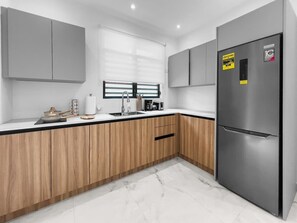 Fridge, microwave, stovetop, coffee/tea maker