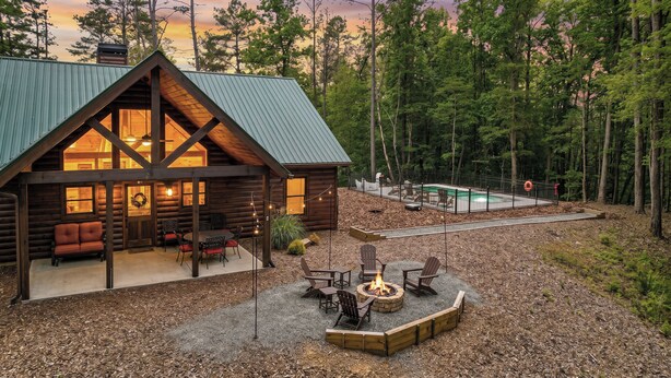 A log cabin with a large deck, outdoor seating, a fire pit, and a swimming pool. - The Liberty Lookout II | Ellijay, Ga (Ellijay)