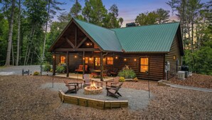 A log cabin with a porch, outdoor seating, and a fire pit. - The Liberty Lookout II | Ellijay, Ga (Ellijay)
