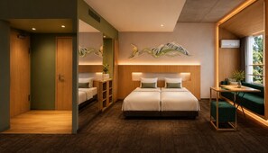 A modern hotel room with a large bed, a small table, a seating area, and a large mirror. - Wadano Onsen Hotel (Hakuba)