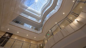 A multi-level atrium with glass ceilings and railings. - Hotel SDU Boutique Al Madinah (Madinah)