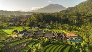 A resort with traditional architecture, terraced gardens, and a pool area. - Devani Resort Sidemen (Sidemen)